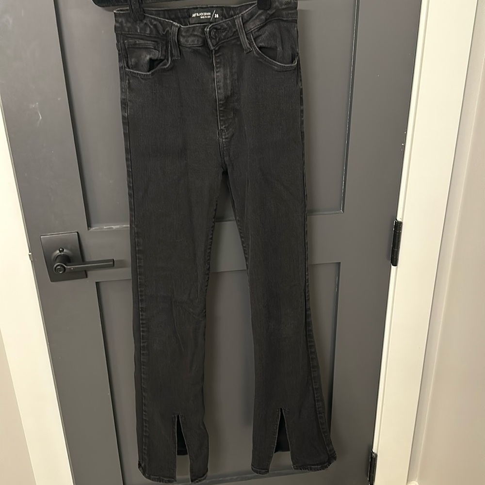Black jeans with front slit hem
